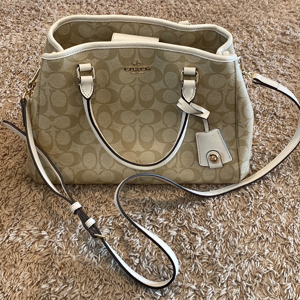 Coach satchel with white accents.